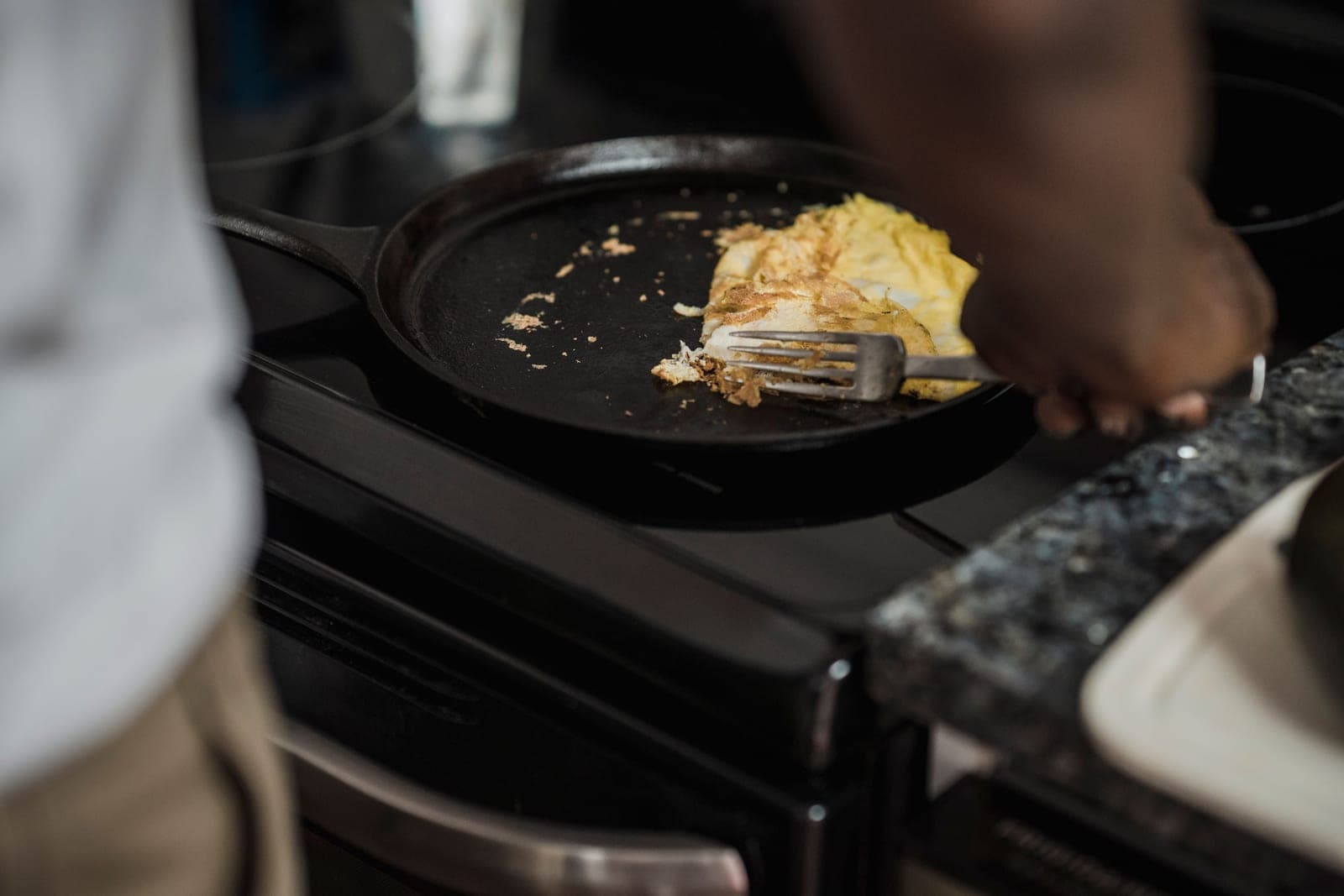 A collection of cast iron cookware on a kitchen surface