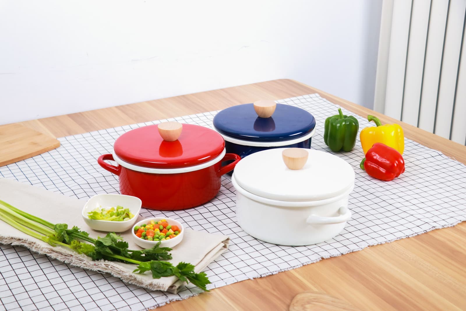 An enameled cast iron dutch oven on a wooden counter