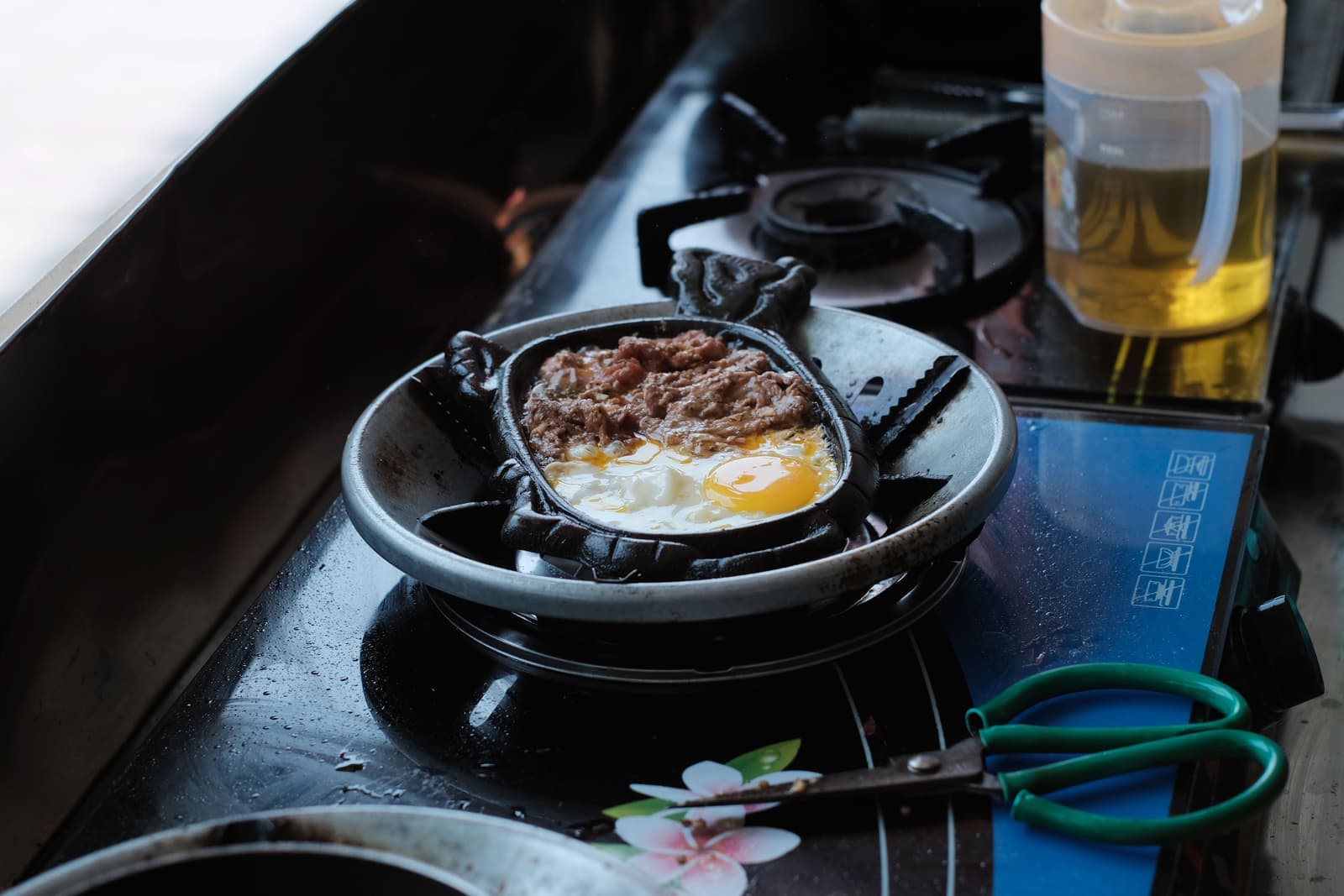 A seasoned cast iron skillet on a stovetop